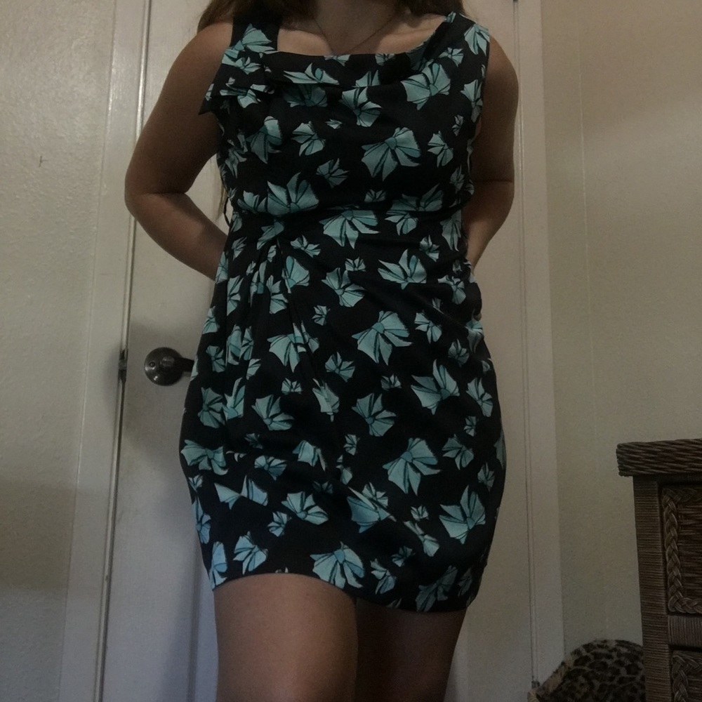 midi dress with blue bows on black background